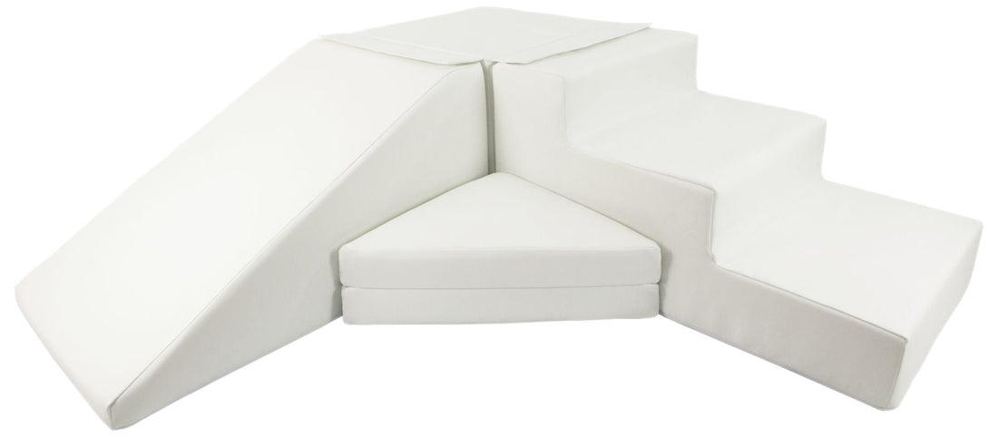 White foam soft play step and slide set in a nursery