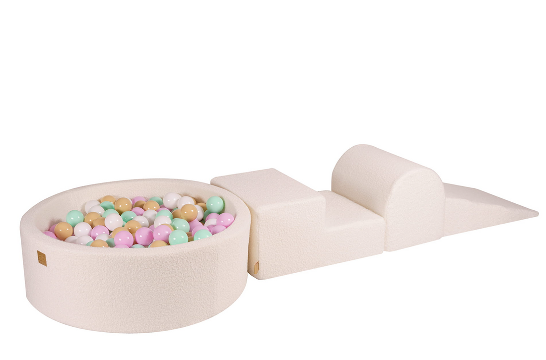 White soft play climbing blocks and ball pit