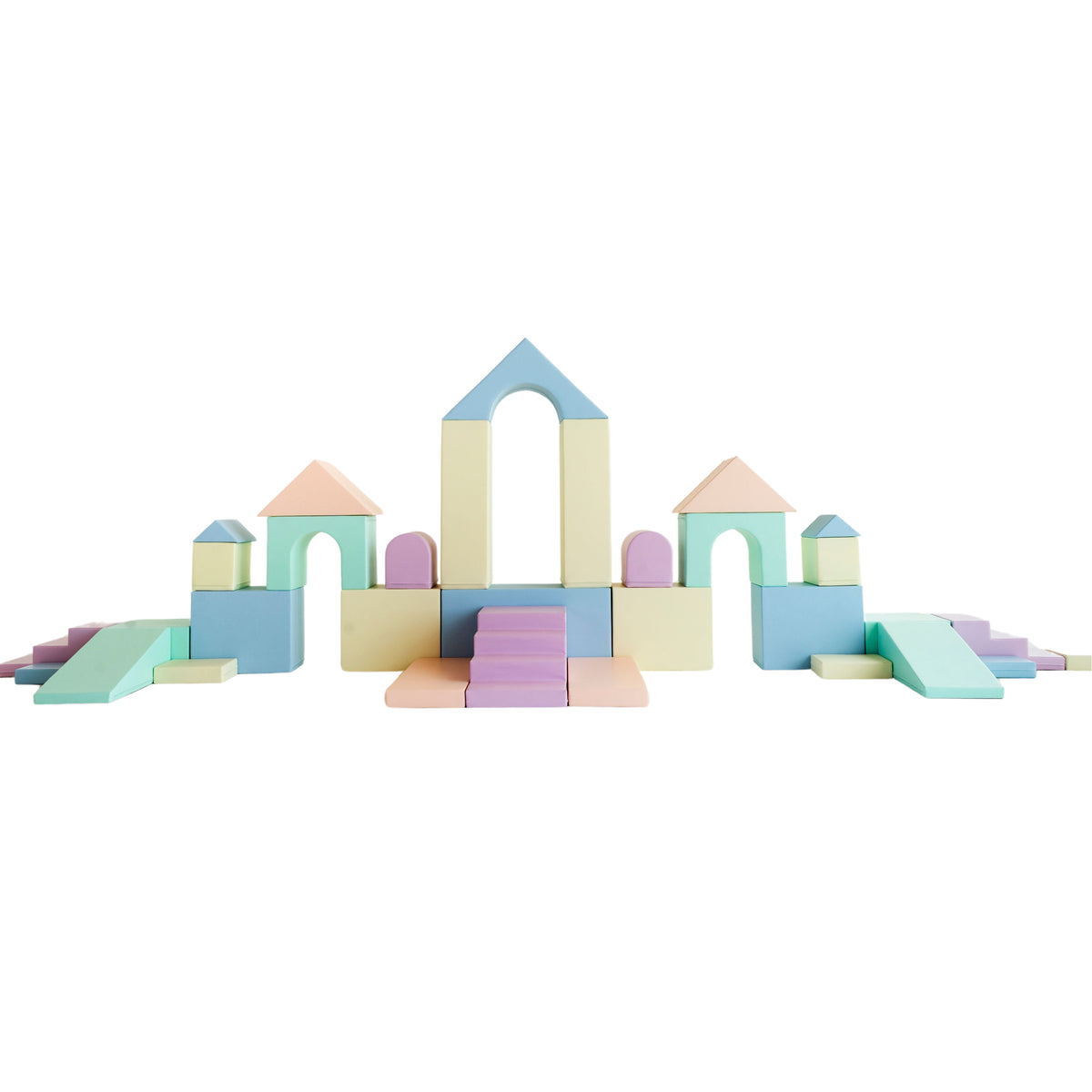 Foam soft play castle set with an arch, climbing steps and slide, built ready for a children's party