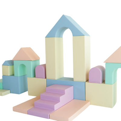 Soft play castle configuration with arch and slide